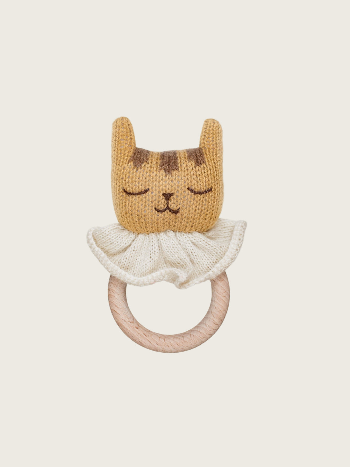 Knitted cat-shaped rattle with a wooden ring