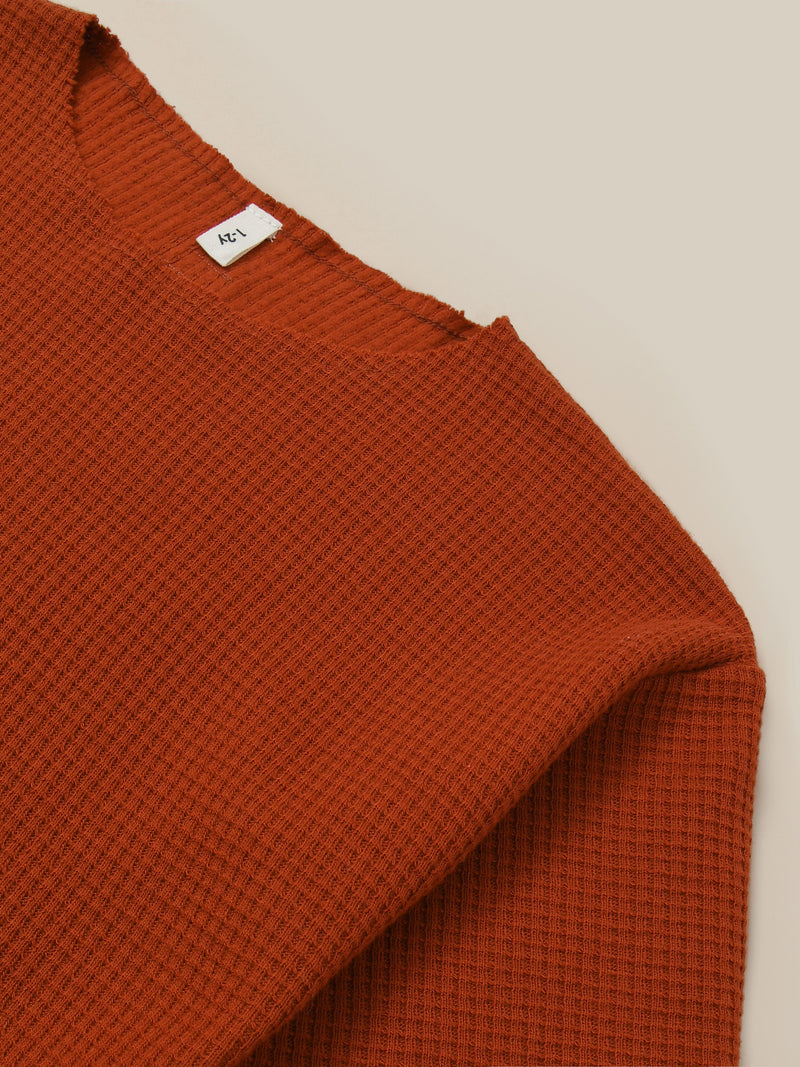 close up of boxy cotton waffle sweatshirt in red