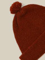 close up of wool beanie in red with tassel