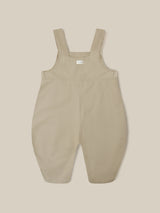 close up of twill cotton oversized farmers dungarees in grey with buttons & side in-seam pockets with gingham finish