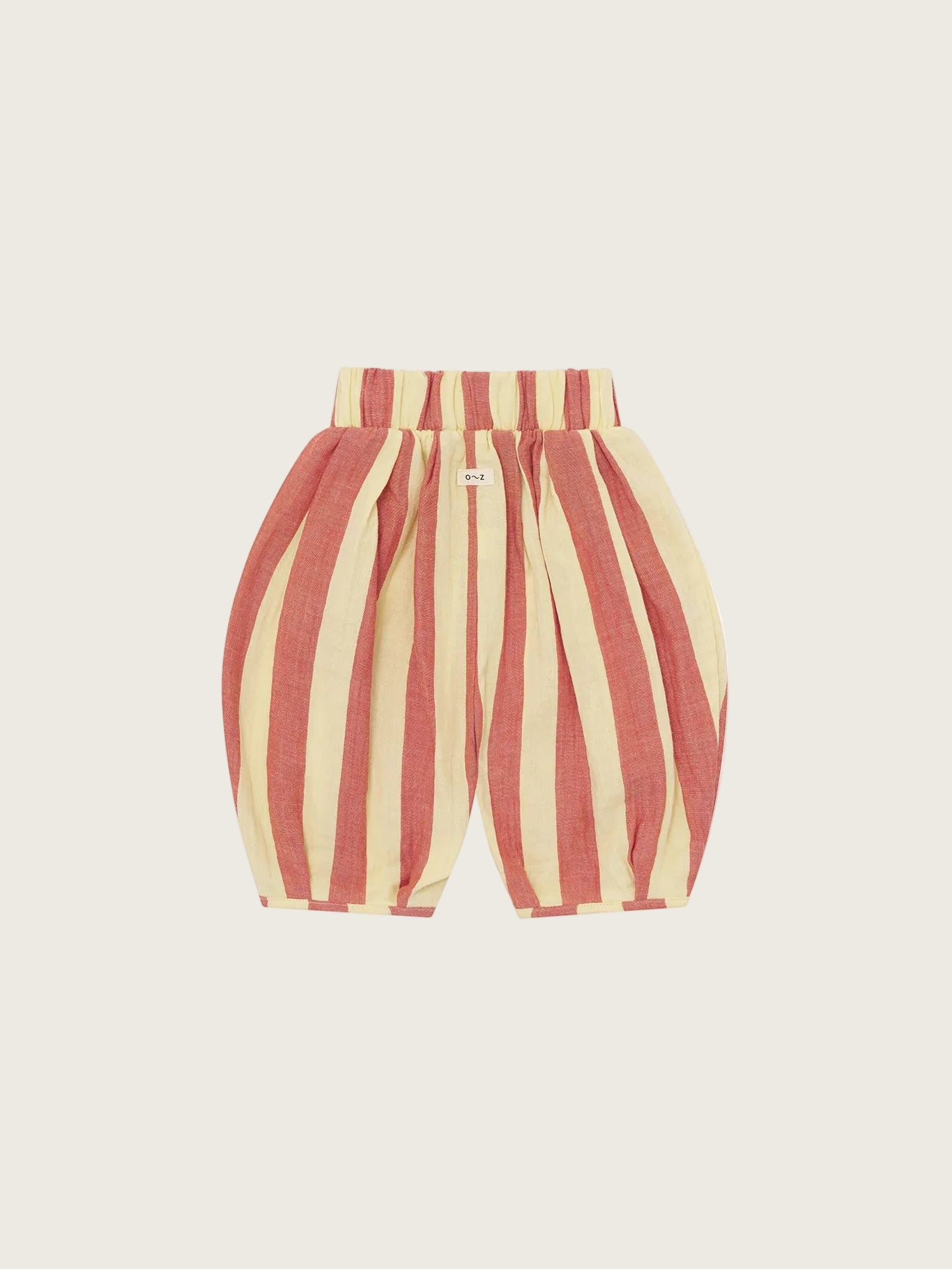 Red and beige striped baby pants on a white background
