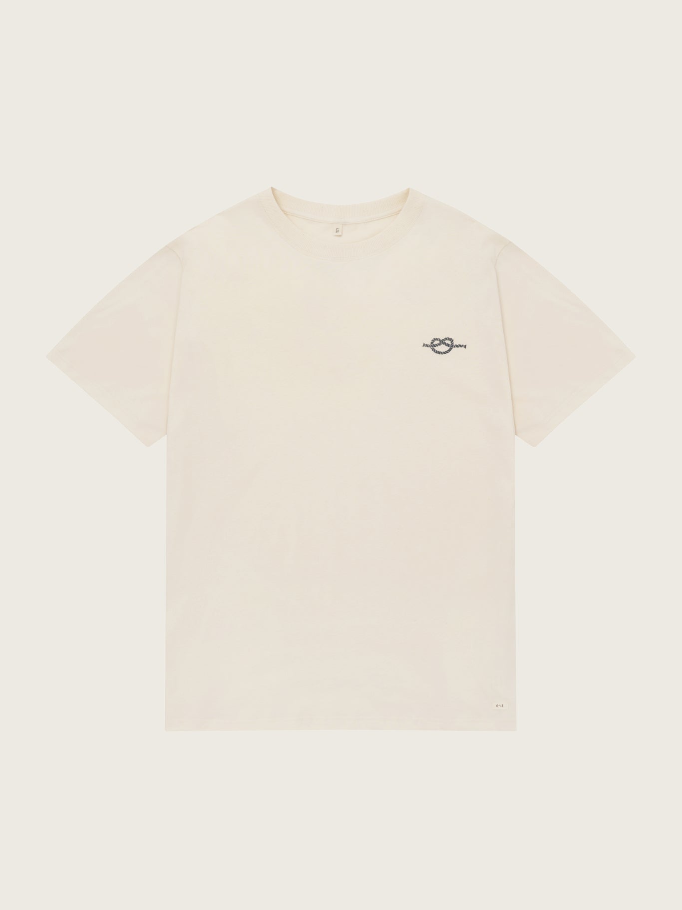 Beige t-shirt with a small logo on a white background
