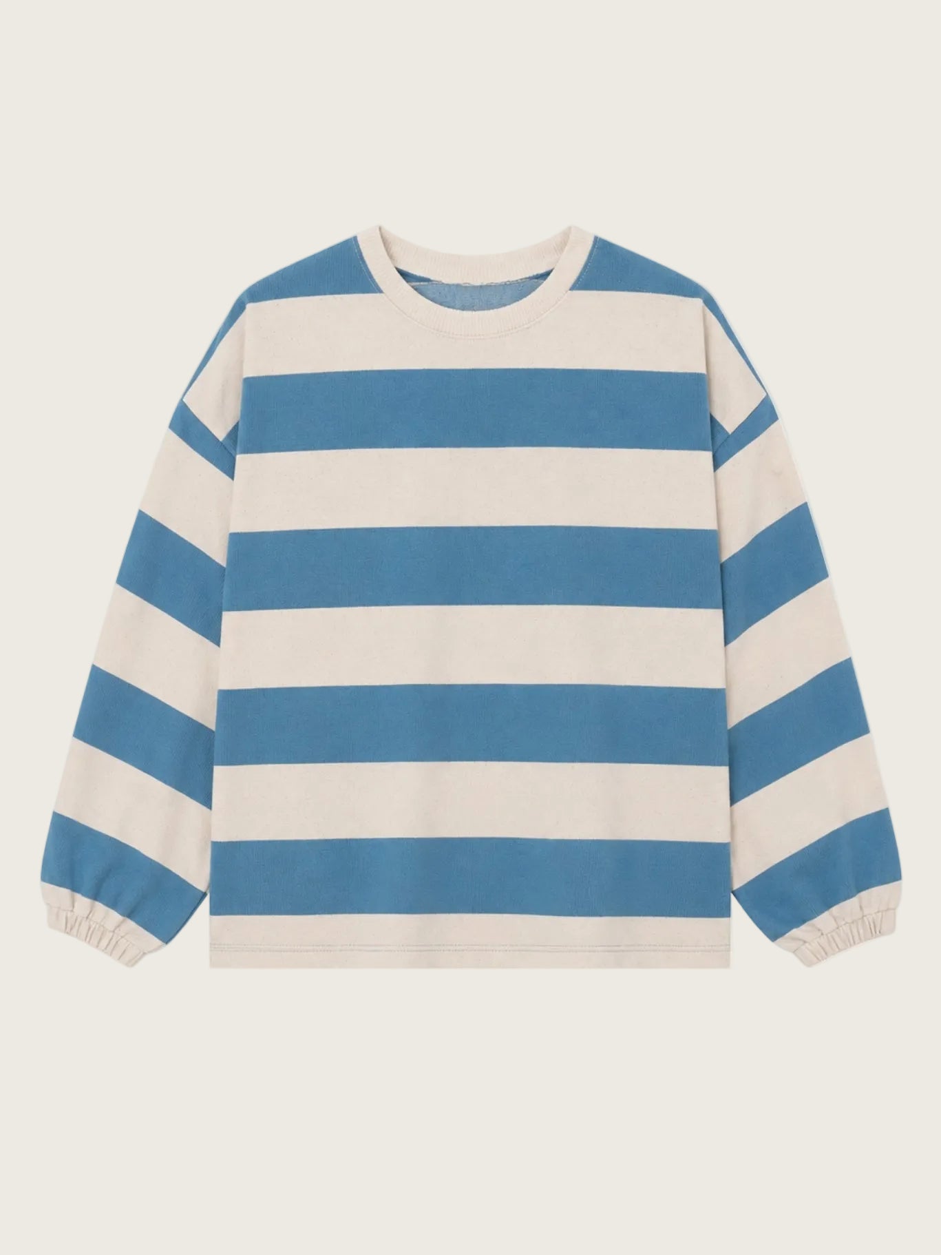 Blue and white striped sweater on a beige background