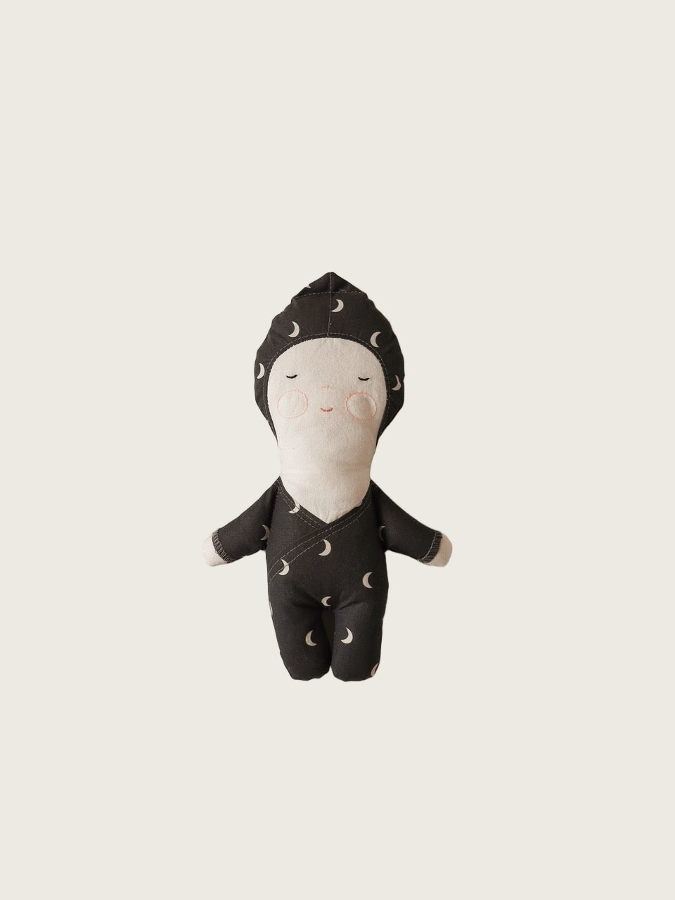 A soft toy doll with a moon pattern